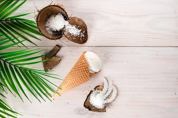 Coconut ice cream with coconut shell, coconut ice cream on a white wooden background with copy space background