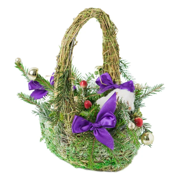 Christmas basket with bow, ball, cotton and spruce branches on a — Stock Photo, Image