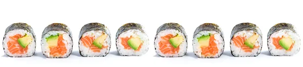 Primo piano di tradizionale pesce fresco giapponese sushi rotoli su un — Foto Stock
