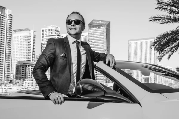 Successful yang businessman in yellow cabrio car. — Stock Photo, Image