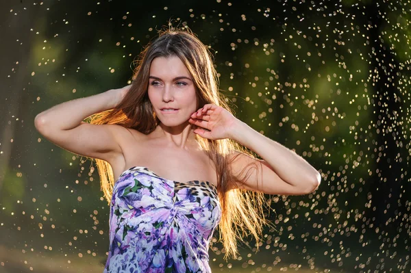 Portrait of a beautiful woman playing outside — Stock Photo, Image