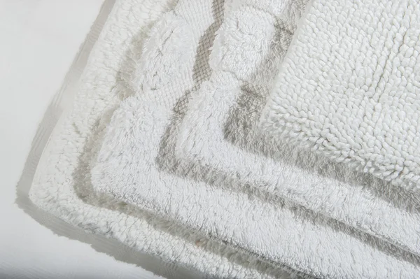 Stack of white bath mats . — Stock Photo, Image