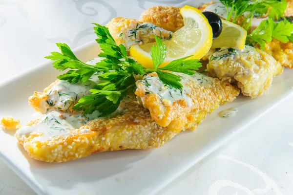 Plate of roasted fish — Stock Photo, Image