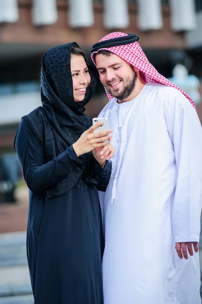 Moderm Arabic couple poses outdoors. — Stock Photo, Image