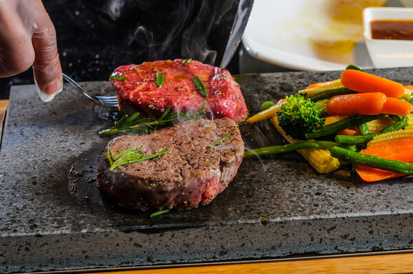 Steak cooked on lava-stone