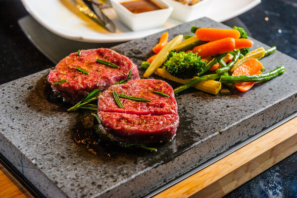 Steak cooked on lava-stone