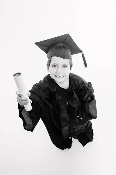 Little boy, just graduated student, looking up — Stock Photo, Image