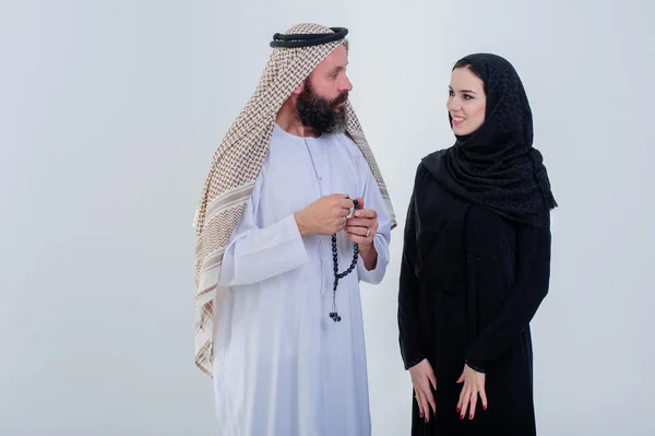 Half body of arabic couple posing together isolated on grey background. — Stock Photo, Image