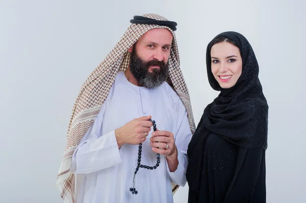 Half body of arabic couple posing together isolated on grey background. — Stock Photo, Image