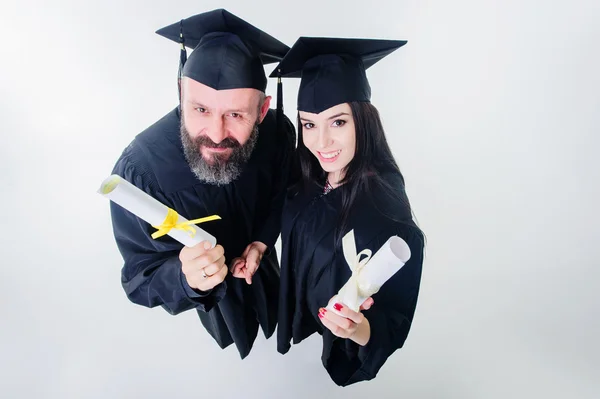 Dos estudiantes adultos graduados felices . — Foto de Stock