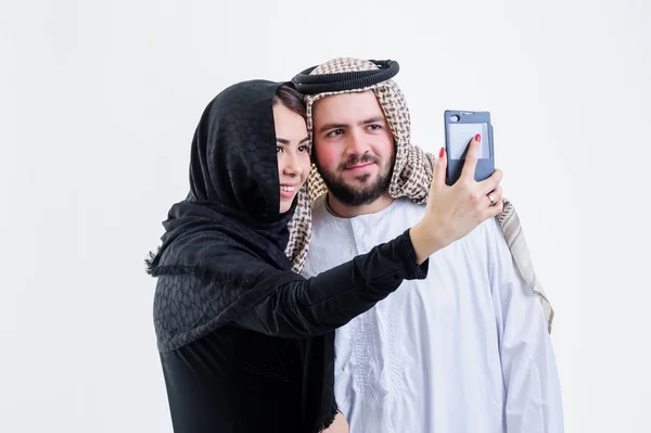 Arabic couple take self pictures with sell phone.Selfie. — Stock Photo, Image