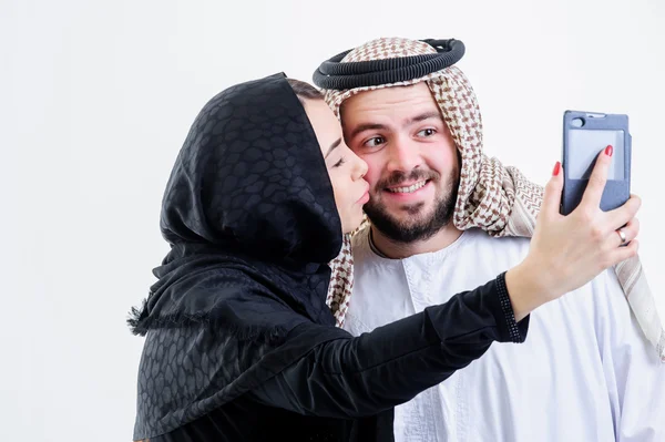 Arabic couple take self pictures with sell phone.Selfie. — Stock Photo, Image