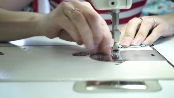 Factory seamstress at work and industrial sewing machine — Stock Video