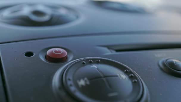 Driver turning on the car audio system. Macro shot — Stock Video