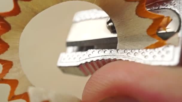 Man sharpening a pencil with small steel sharpener, macro video — Stock Video