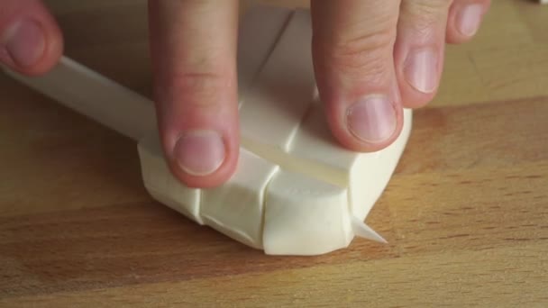 Amateur cooking of Greek salad. Part of the set. Man cutting feta cheese — Stock Video