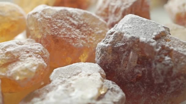 Big crystals of brown sugar, macro dolly shot — Stock Video