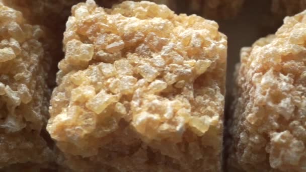 Macro dolly video of brown sugar cubes — Stock Video