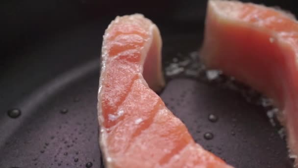 Macro dolly video of frizzling salmon steak — Stock Footage Macro dolly video of frizzling salmon steak Stock Footage