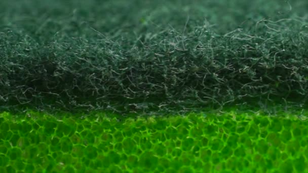 Esponja lavavajillas verde macro video — Vídeo de stock