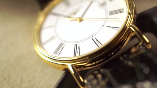 Golden classical wrist watch macro shot. Slow motion video — Stock Video