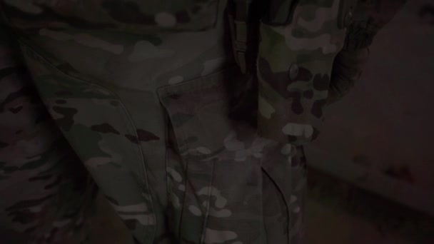 Pistol in a camouflaged holster. Close up video — Stock Video