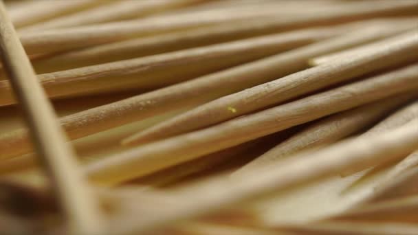 Pile of wooden toothpicks macro dolly shot — Stock Video