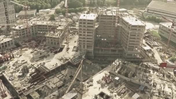 Aerial view of cranes on big construction site of dwelling houses and offices — Stock Video