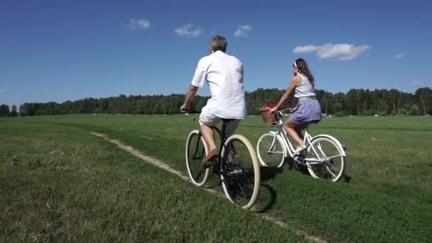 Summer field classical bicycling, slow motion steadicam shot — Stock Video