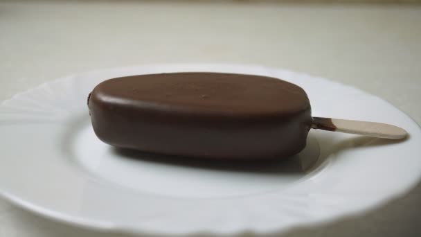 Melting chocolate covered ice cream time lapse video — Stock Video