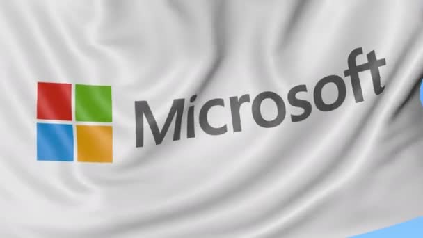 Primer plano de la bandera ondeante con el logotipo de Microsoft, bucle sin costuras, fondo azul. Animación editorial. 4K ProRes, alfa — Vídeo de stock