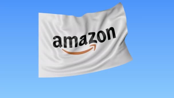 Vlající vlajka s logem Amazon.com, bezešvá smyčka, modré pozadí. Redakční animace. 4 k Prores, alfa — Stock video
