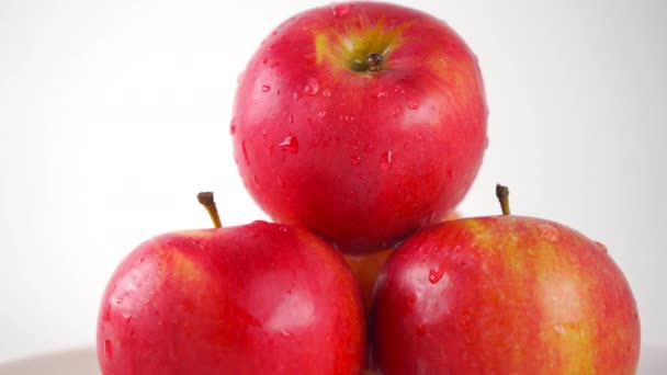 Red apples and dripping water, light background. 4K ProRes close up dolly shot — Stock Video