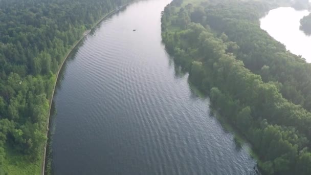 Aerial shot of anchored boat on the river — Stock Video