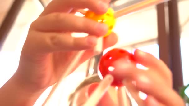 Little boy playing with colored plastic construction set. Molecule models. 4K close up shot — Stock Video