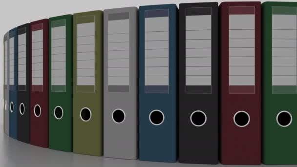 Вращение разноцветных офисных папок. Бесшовная анимация цикла 4K — стоковое видео