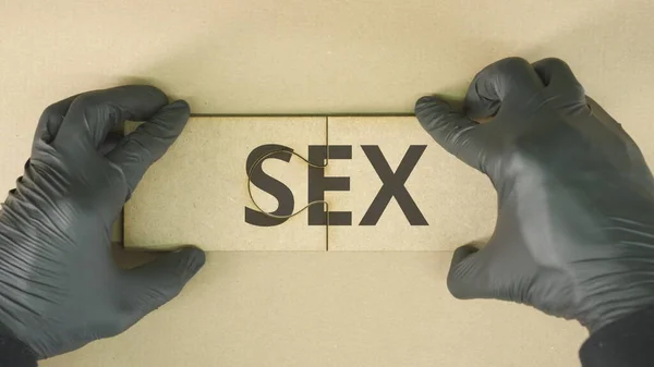 Composing two jigsaw puzzle pieces with SEX text — Stock Photo, Image
