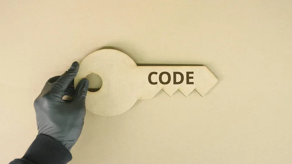 Codetekst op het sleutelpictogram — Stockfoto