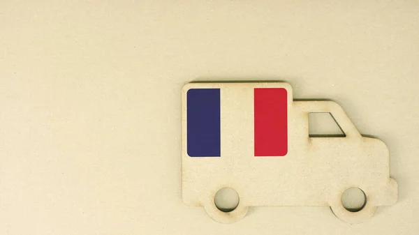 Recycled cardboad truck icon with flag of France. National sustainable transportation or delivery concept — Stock Photo, Image