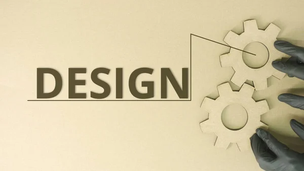 Design word and cardboard cog wheels — Stock Photo, Image