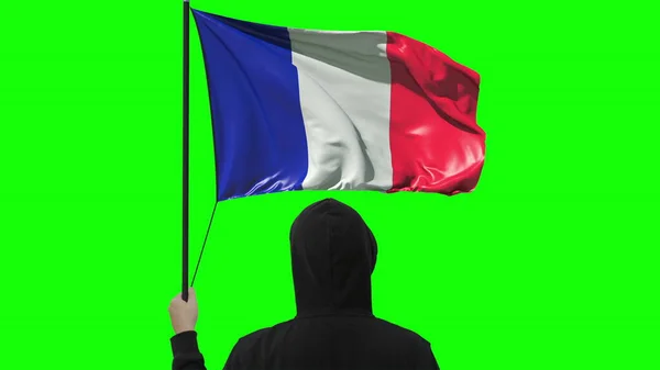 Bandeira da França e homem desconhecido, isolado sobre fundo verde — Fotografia de Stock