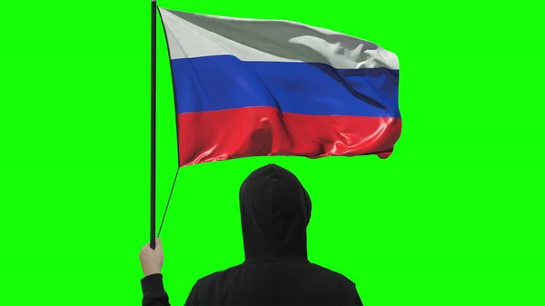 Unknown man holds waving flag of Russia, isolated on green background — Stock Photo, Image