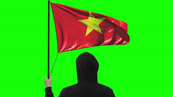 Flagge Vietnams und unbekannter Mann, isoliert auf grünem Hintergrund — Stockfoto