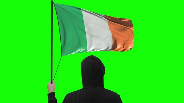 Flag of Ireland and unknown man, isolated on green background — Stock Photo, Image