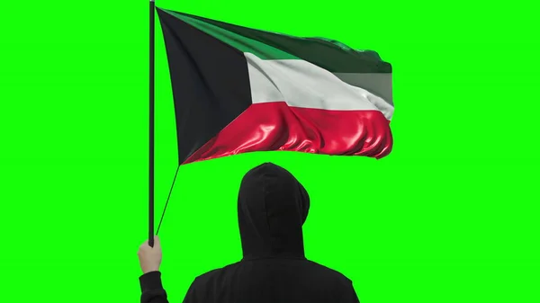 Bandiera del Kuwait e uomo sconosciuto, isolato su sfondo verde — Foto Stock