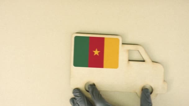 Recycled cardboad truck icon with flag of Cameroon. National sustainable transportation or delivery concept — Stock Video