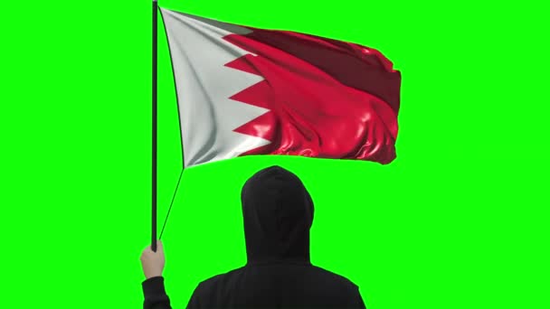 Waving flag of Bahrain and unknown man wearing black, alpha matte — Stock Video