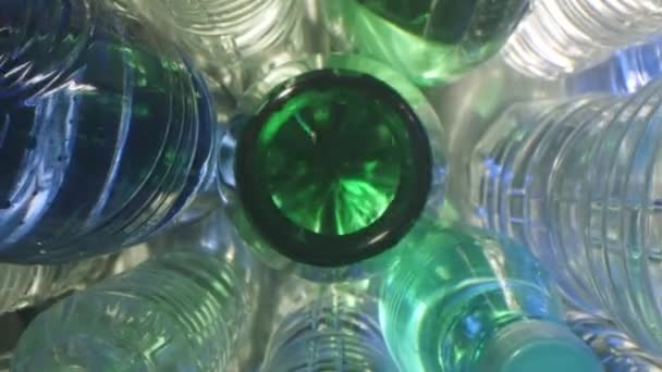 Probe lens dolly macro shot inside a green plastic bottle of carbonated water — Stock Video