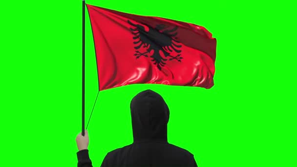 Unknown man holds waving flag of Albania, alpha matte — Stock Video