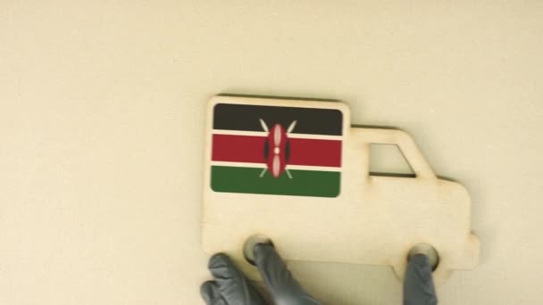 Icono de camión de cartón reciclado con bandera de Kenia. Concepto nacional de transporte o entrega sostenible — Vídeos de Stock